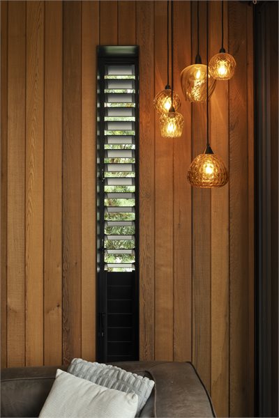 Louvre windows become a unique feature in this living space