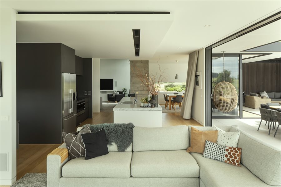 Modern open plan living space complemented by tall sliding doors